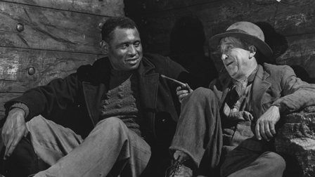 Paul Robeson (on L) stars in The Proud Valley